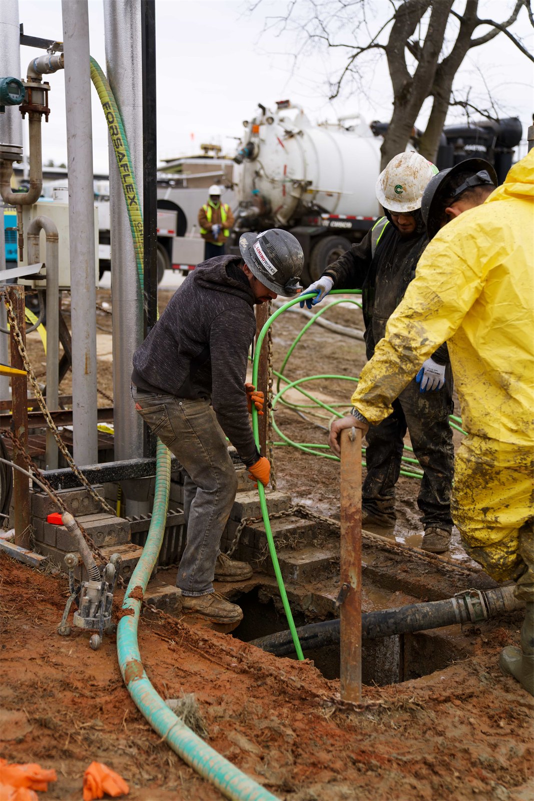 LiningWorks crew running a large-scale trenchless sewer lining installation with specialized equipment.