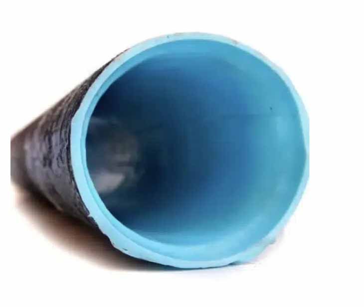 Interior of a sewer pipe after cured-in-place lining: the seamless new wall a sewer lining installation creates.