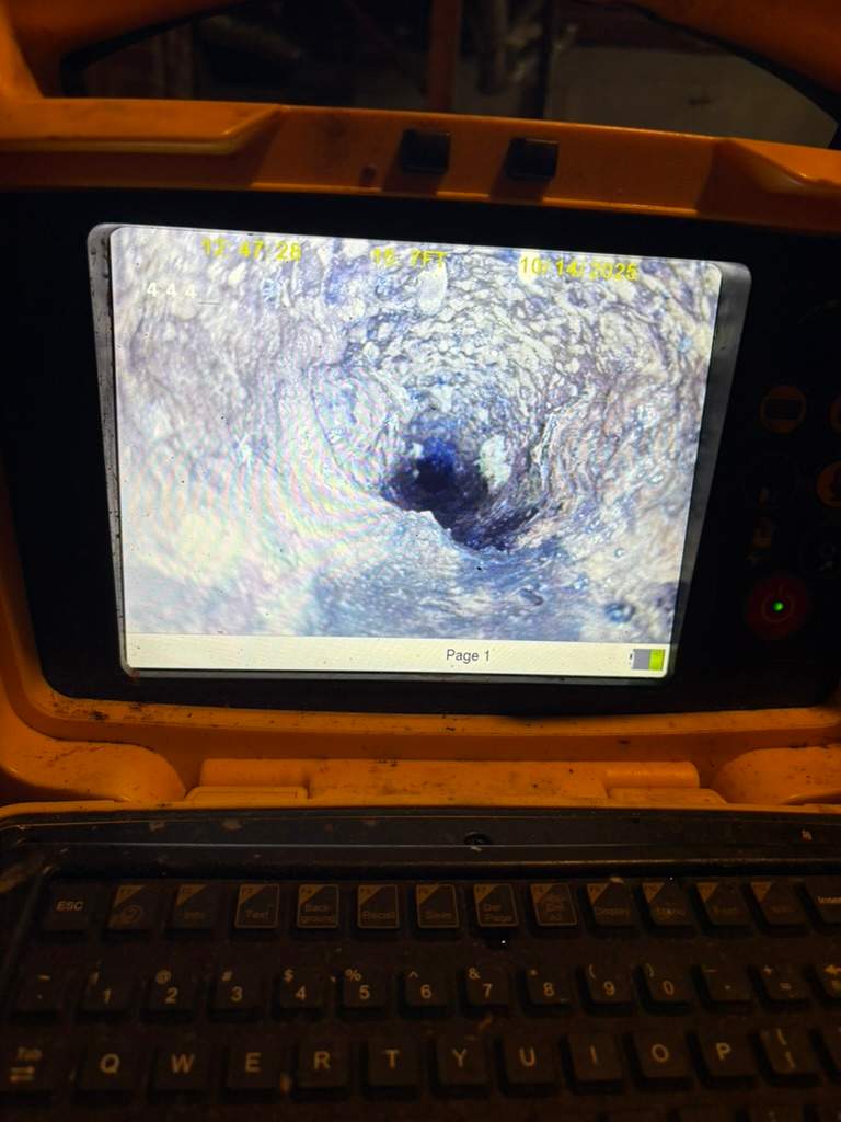 LiningWorks Trenchless Pipe Repair & Sewer Pipe Lining technician performing digital pipe evaluation with a sewer scope
