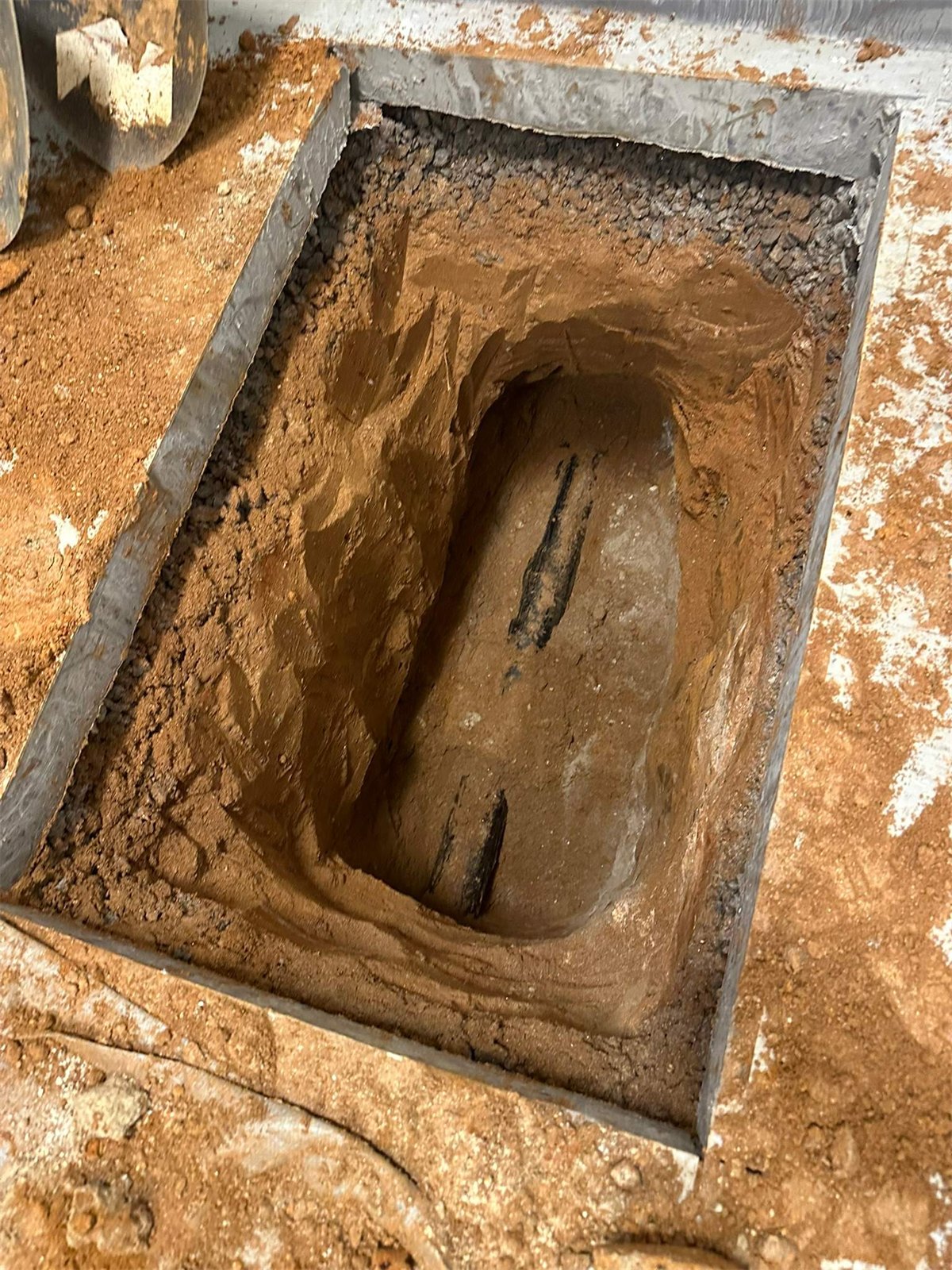 LiningWorks excavating a targeted access pit to repair a collapsed drain line.