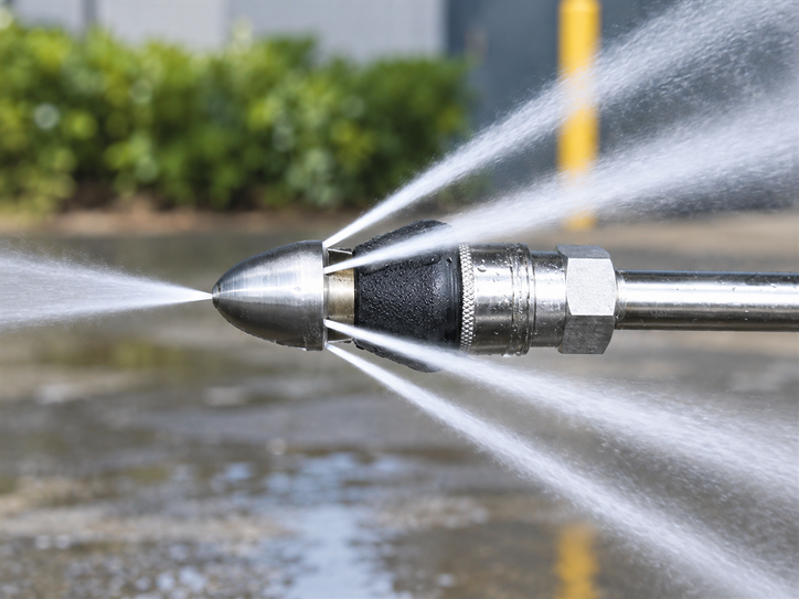 High-pressure hydro jetting nozzle used to cut through blockages inside a sewer line.