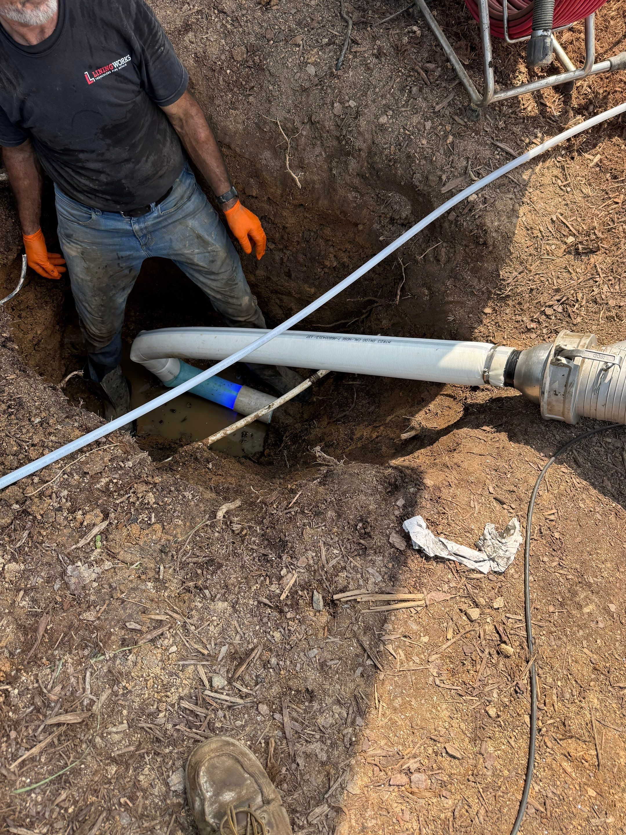 Two LiningWorks technicians reviewing camera footage from a blockages inspection.