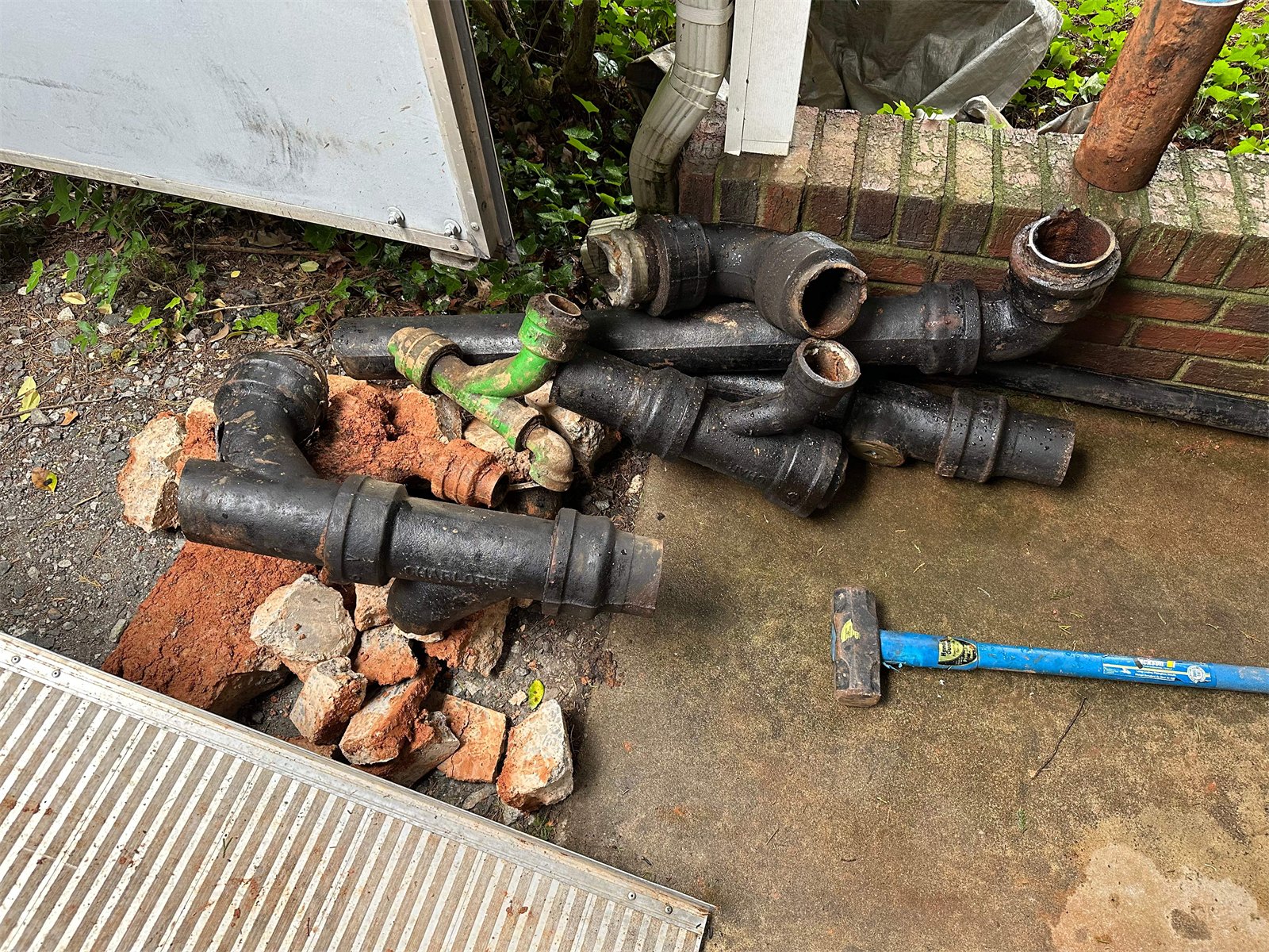 Corroded cast iron stack sections removed by LiningWorks during a relining project.