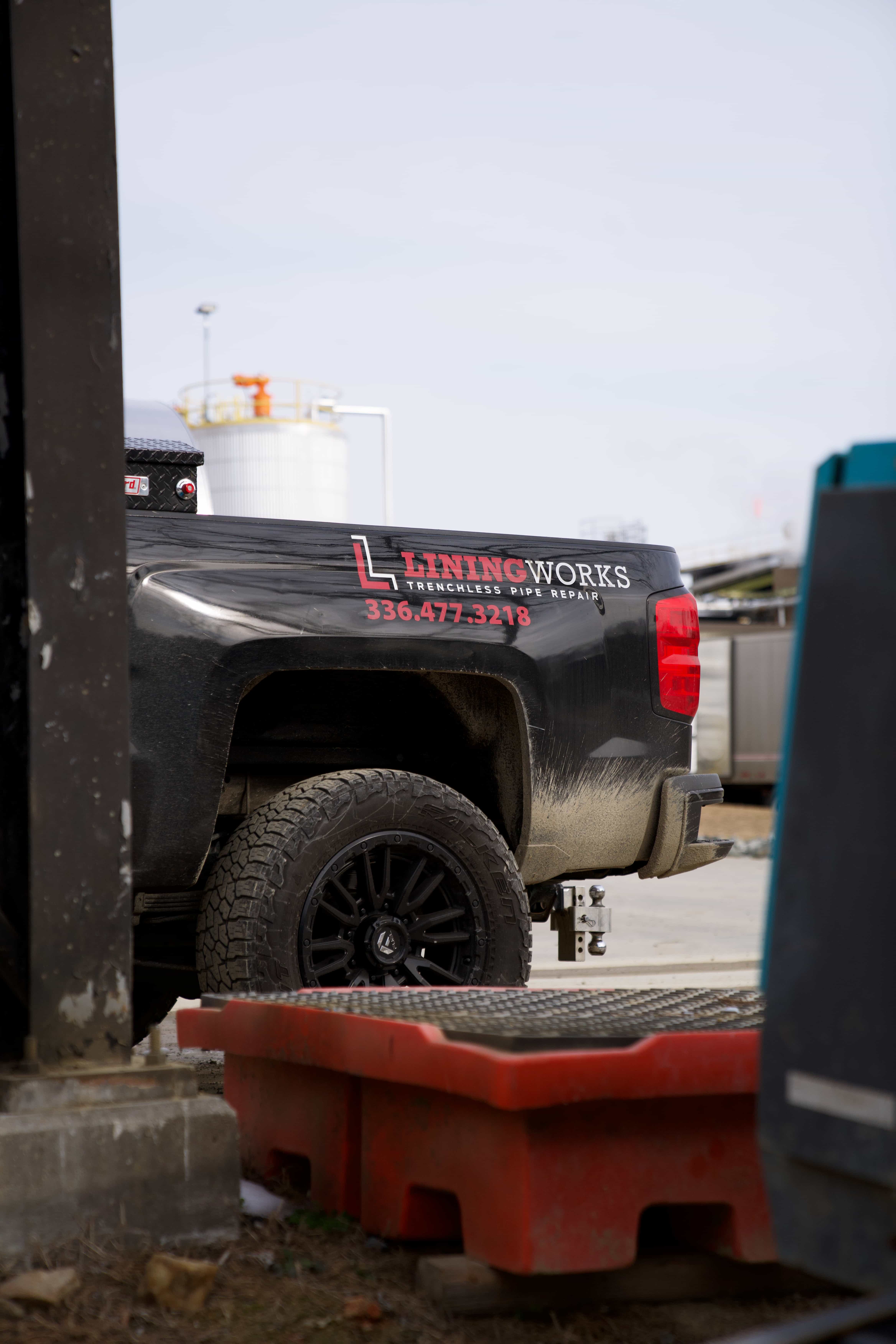 LiningWorks service truck at a Charlotte sewer line locating job.