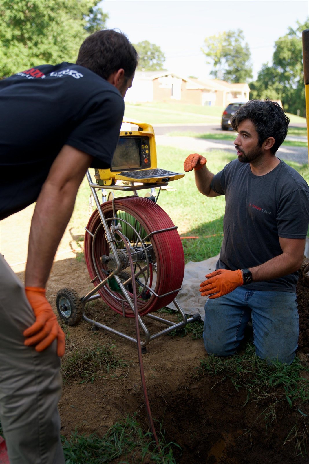 LiningWorks crew running a sewer camera inspection before recommending a line replacement.
